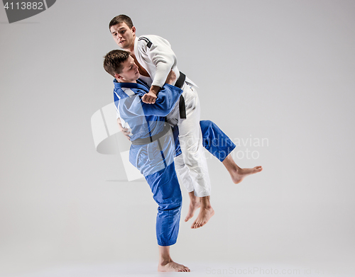 Image of The two judokas fighters fighting men