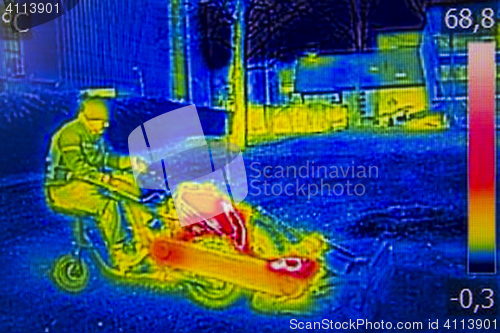 Image of Infrared Thermal image worker cutting grass in city park