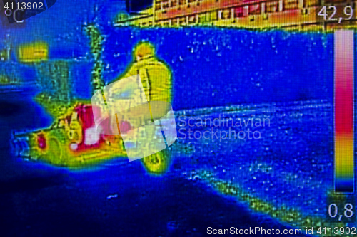 Image of Infrared Thermal image worker cutting grass in city park