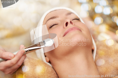 Image of close up of young woman and cosmetologist in spa