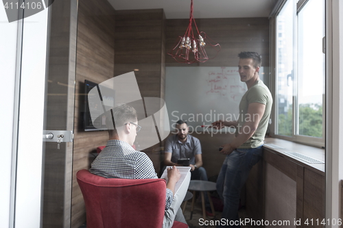 Image of team meeting and brainstorming in small private office