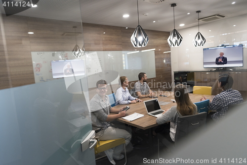 Image of start up business people group attending videoconference call