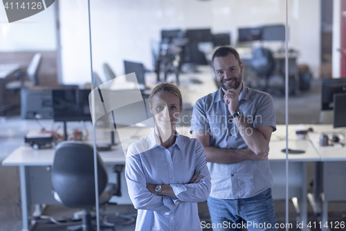 Image of business couple at office