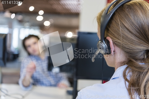 Image of female support phone operator