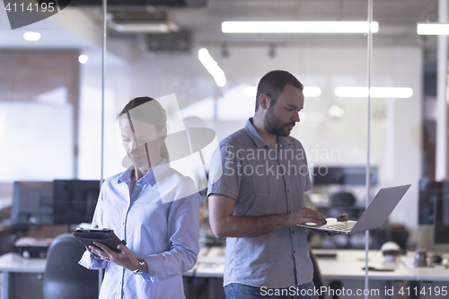Image of business couple at office