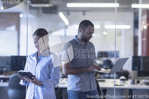 Image of business couple at office