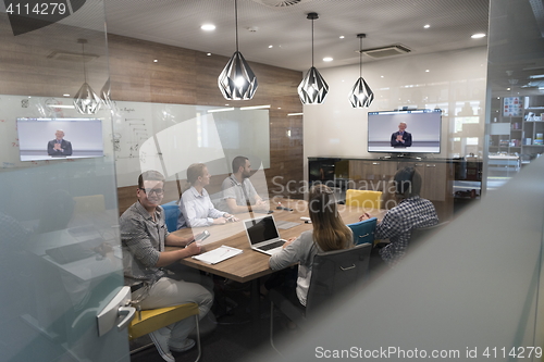 Image of start up business people group attending videoconference call