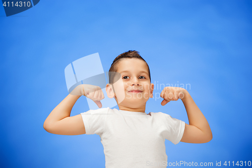 Image of Beauty smiling sport child boy showing his biceps