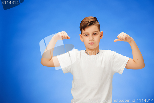 Image of Beauty smiling sport child boy showing his biceps