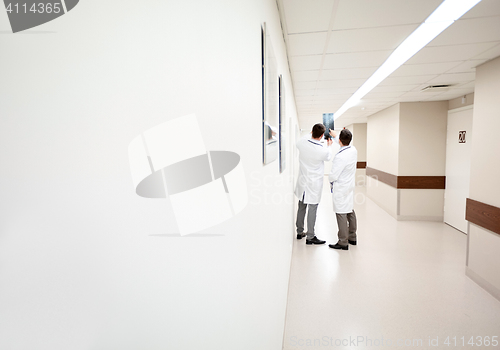 Image of medics with spine x-ray scan at hospital