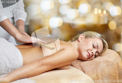 Image of close up of woman lying and having massage in spa