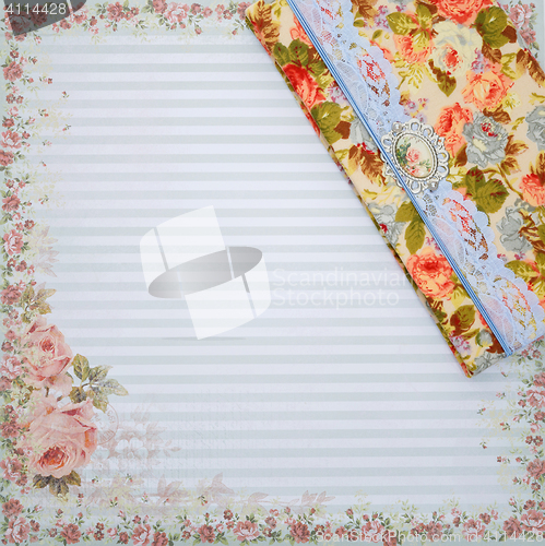 Image of Scrapbooking holder for travel documents on floral paper