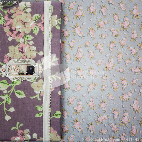 Image of Scrapbooking holder for travel documents on floral paper