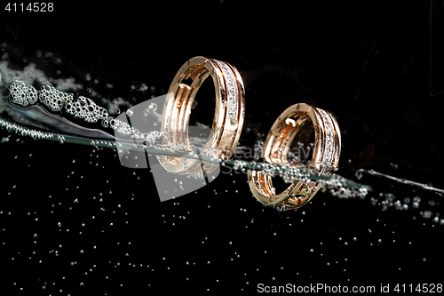 Image of Golden Rings In The Water
