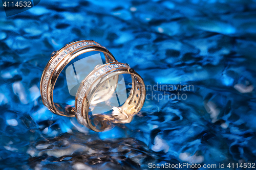 Image of Golden Rings In The Water