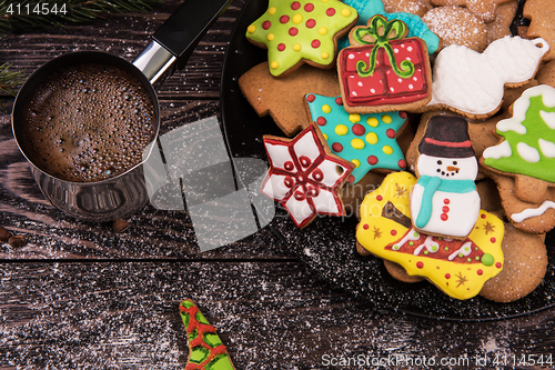 Image of Gingerbreads and coffee for new years or christmas