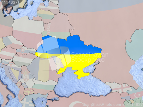 Image of Ukraine with flag on globe