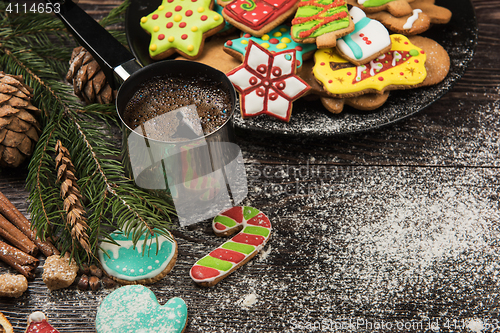 Image of Gingerbreads and coffee for new years or christmas