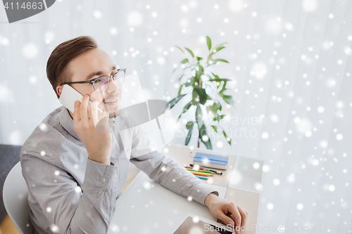 Image of happy creative male worker calling on smarphone