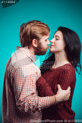 Image of Young man and woman kissing