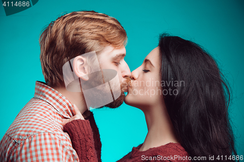 Image of Young man and woman kissing