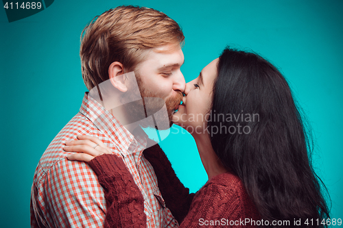 Image of Young man and woman kissing