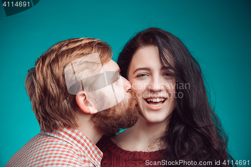 Image of Young man and woman kissing