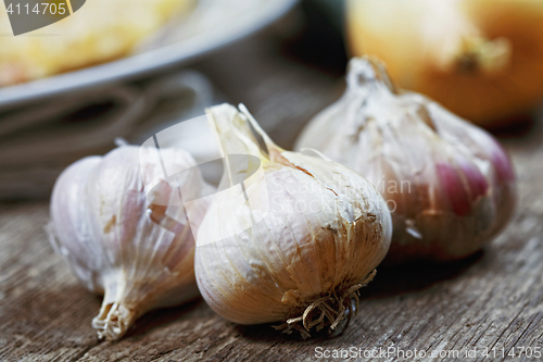 Image of Garlic on wooden table