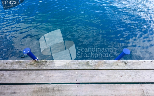 Image of Wooden wharf and blue water