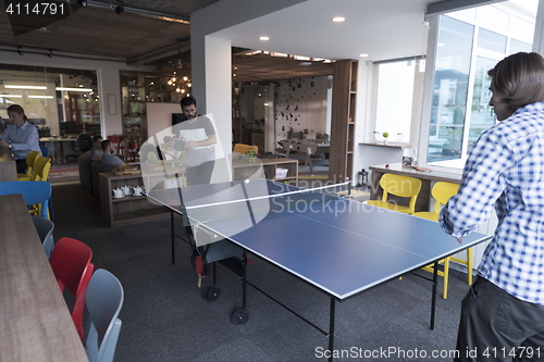 Image of playing ping pong tennis at creative office space