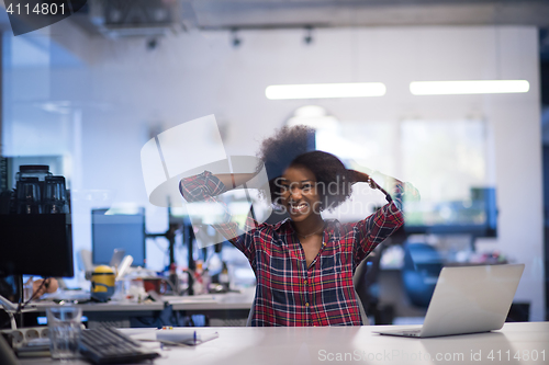 Image of young black woman at her workplace in modern office  African-Ame