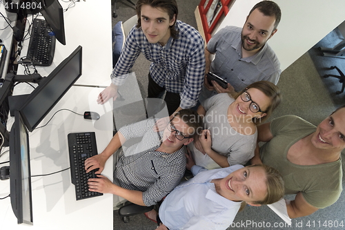 Image of startup business people group working as team to find solution