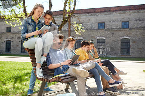 Image of group of students with tablet pc at school yard