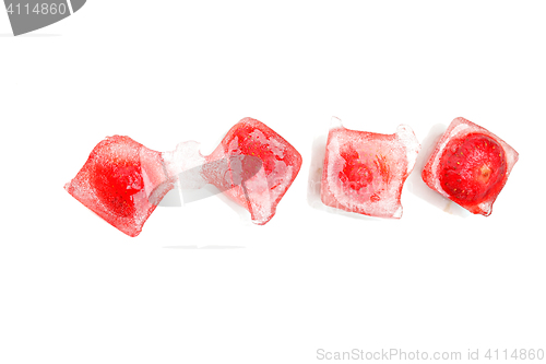 Image of Four strawberries in ice