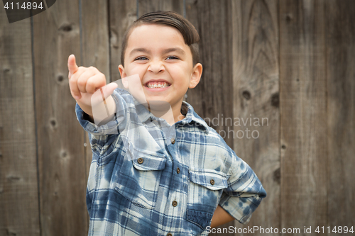Image of Young Mixed Race Boy Making Shaka Hand Gesture