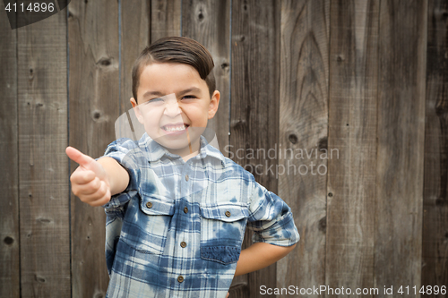 Image of Young Mixed Race Boy Making Hand Gestures