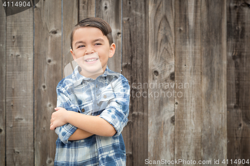 Image of Young Mixed Race Boy Portrait Against Fence