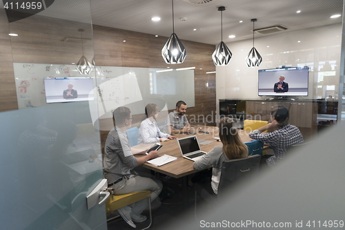 Image of start up business people group attending videoconference call