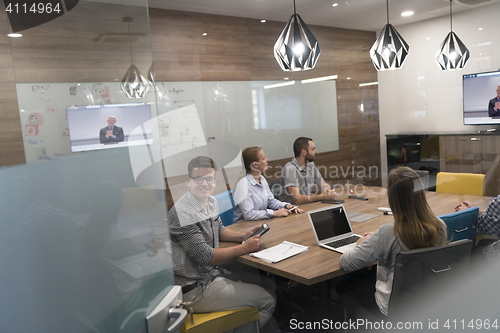 Image of start up business people group attending videoconference call