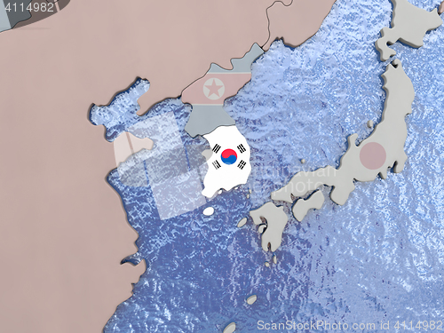 Image of South Korea with flag on globe