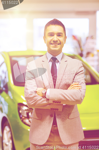 Image of happy man at auto show or car salon
