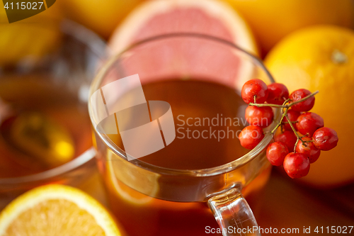 Image of close up of tea cup with rowanberry