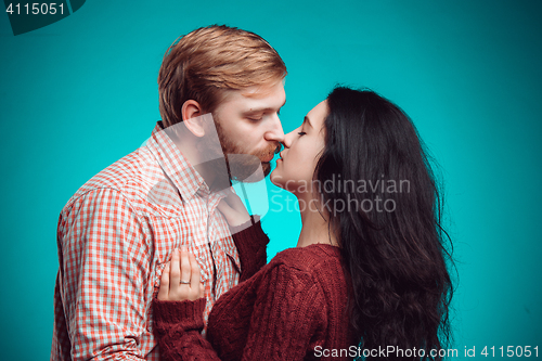 Image of Young man and woman kissing