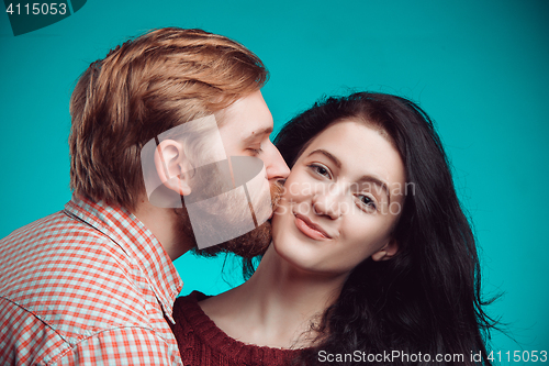 Image of Young man and woman kissing