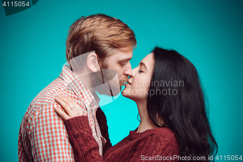 Image of Young man and woman kissing