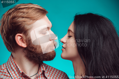 Image of Young man and woman kissing