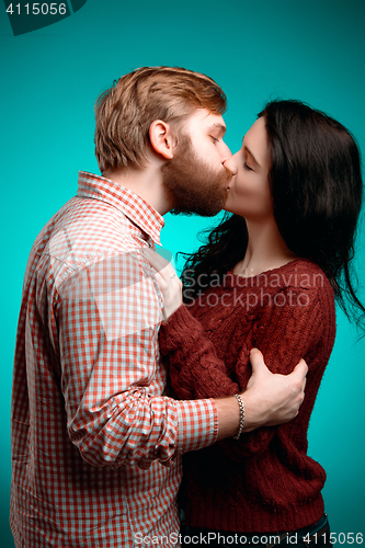 Image of Young man and woman kissing