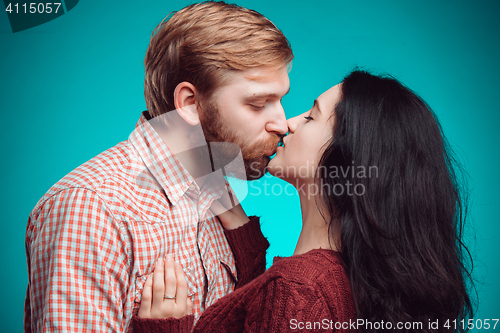 Image of Young man and woman kissing