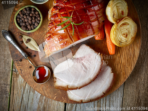 Image of roasted pork on wooden cutting board