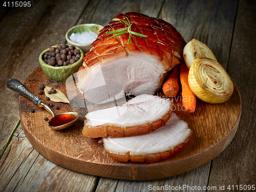 Image of roasted pork on wooden cutting board